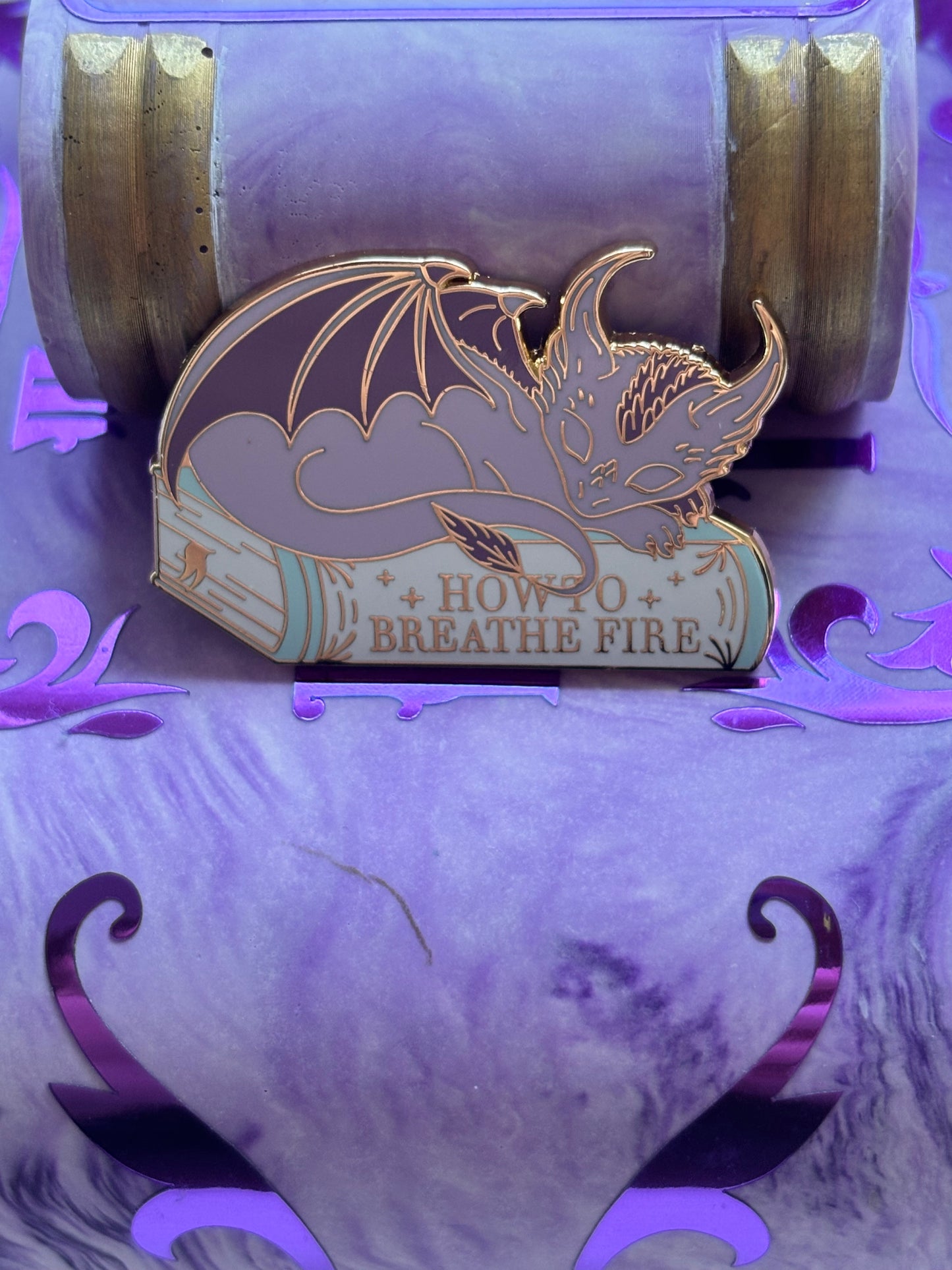 Baby Sleeping Dravon Bookstack Pin Badge. How to breathe fire.