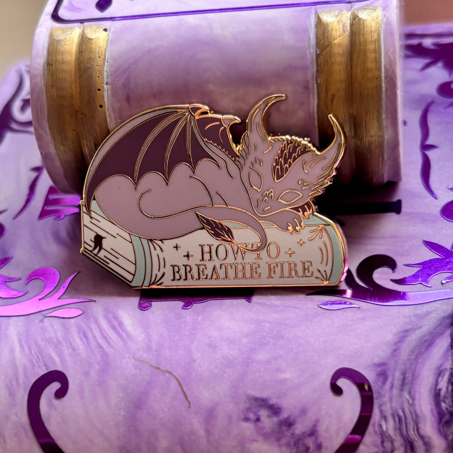 Baby Sleeping Dravon Bookstack Pin Badge. How to breathe fire.