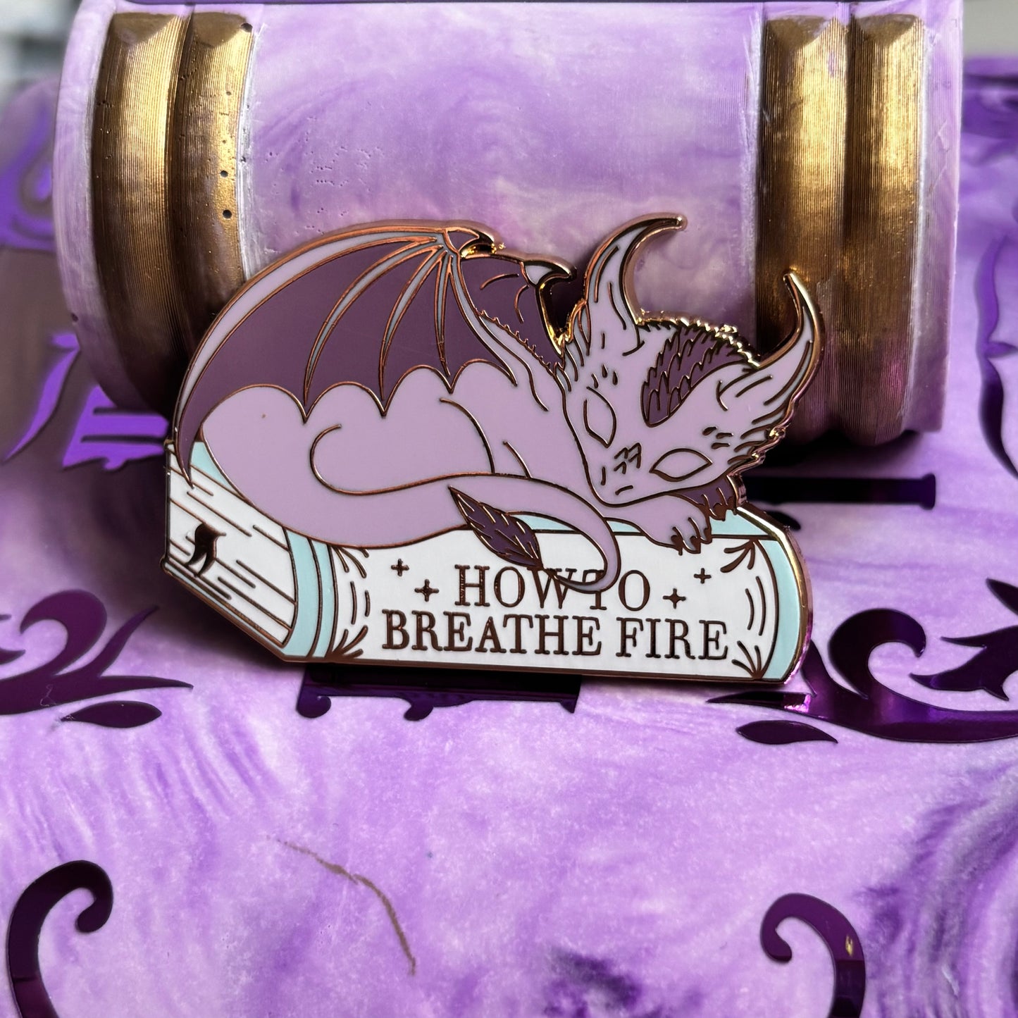 Baby Sleeping Dravon Bookstack Pin Badge. How to breathe fire.