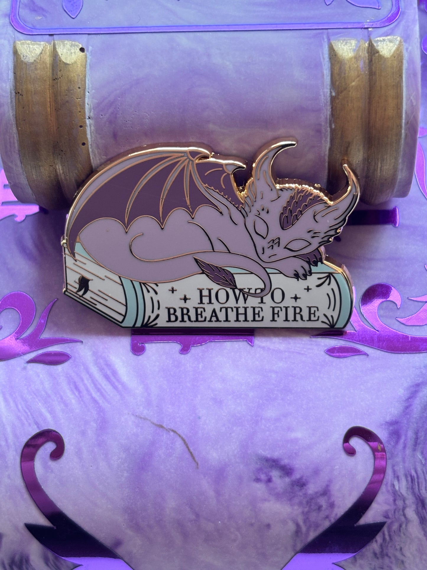 Baby Sleeping Dravon Bookstack Pin Badge. How to breathe fire.