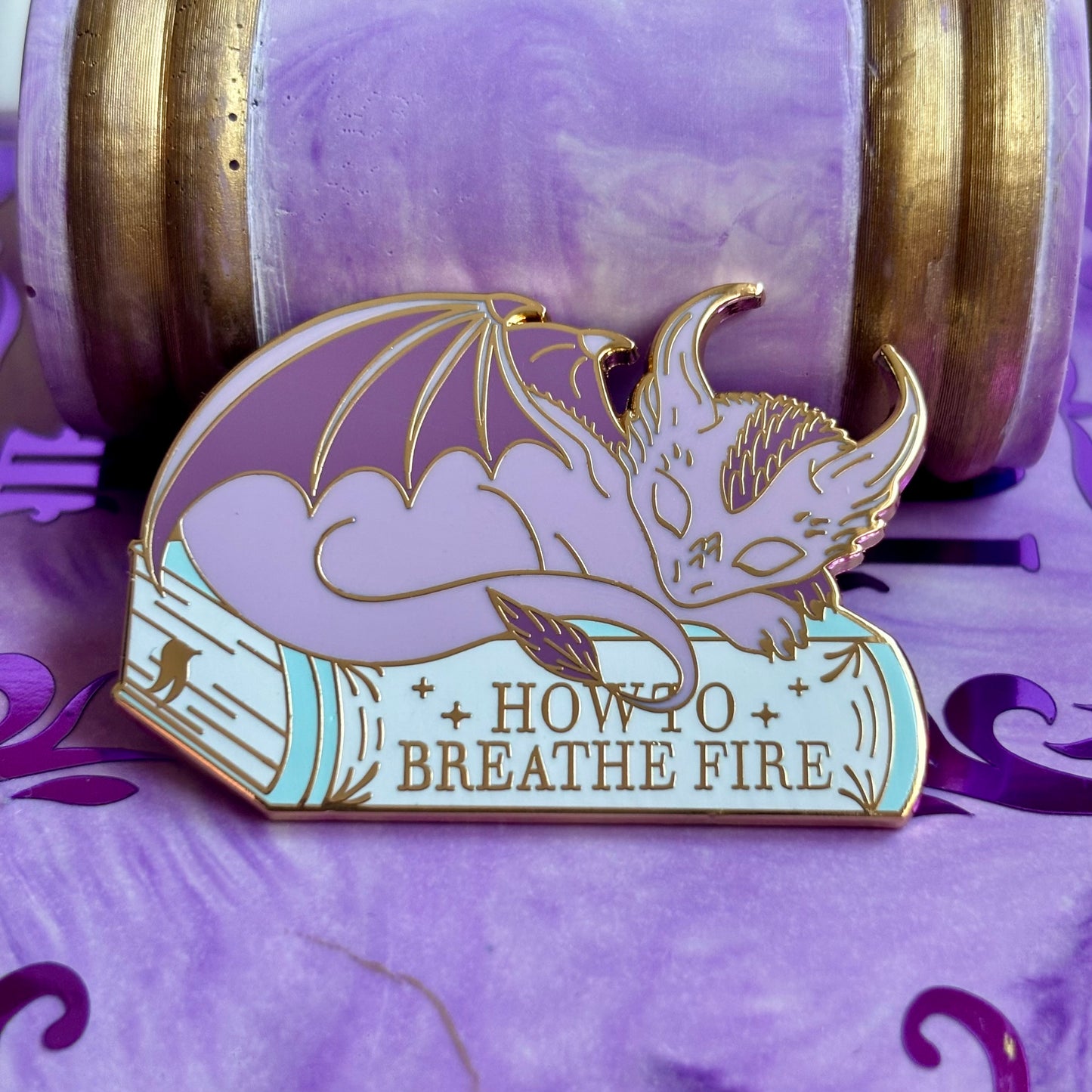 Baby Sleeping Dravon Bookstack Pin Badge. How to breathe fire.