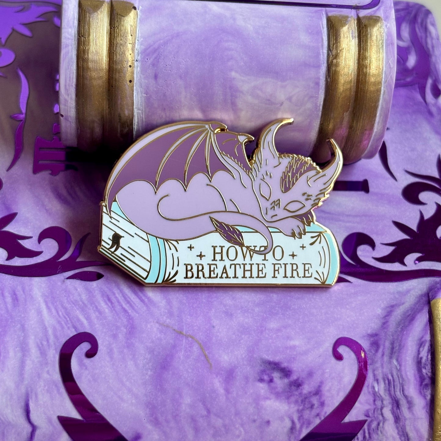 Baby Sleeping Dravon Bookstack Pin Badge. How to breathe fire.