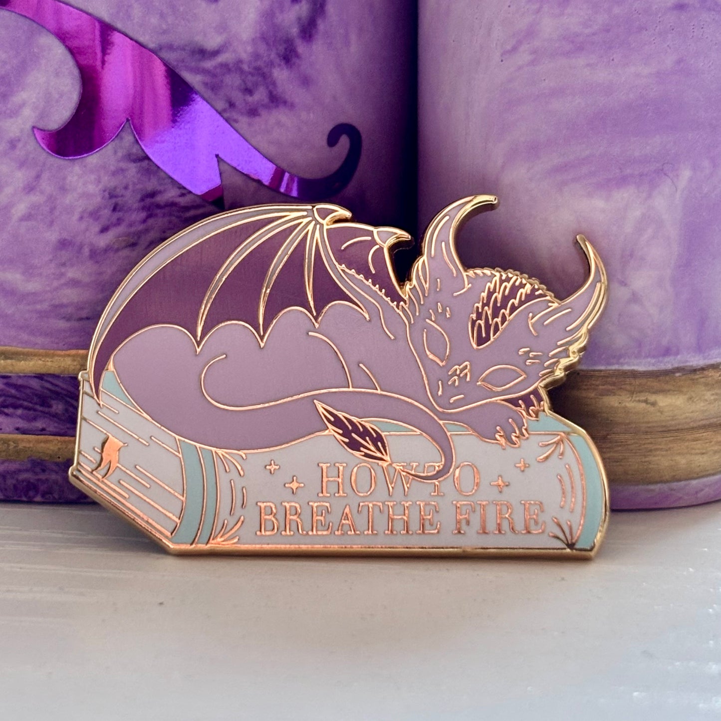 Baby Sleeping Dravon Bookstack Pin Badge. How to breathe fire.