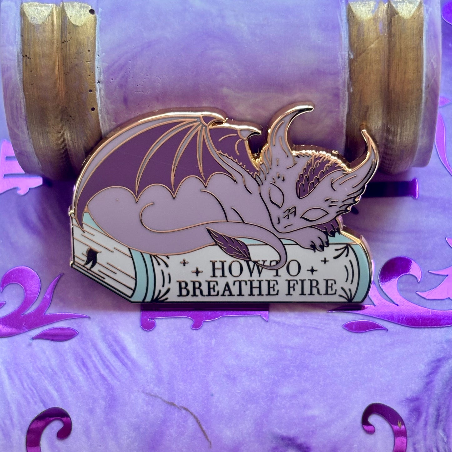 Baby Sleeping Dravon Bookstack Pin Badge. How to breathe fire.