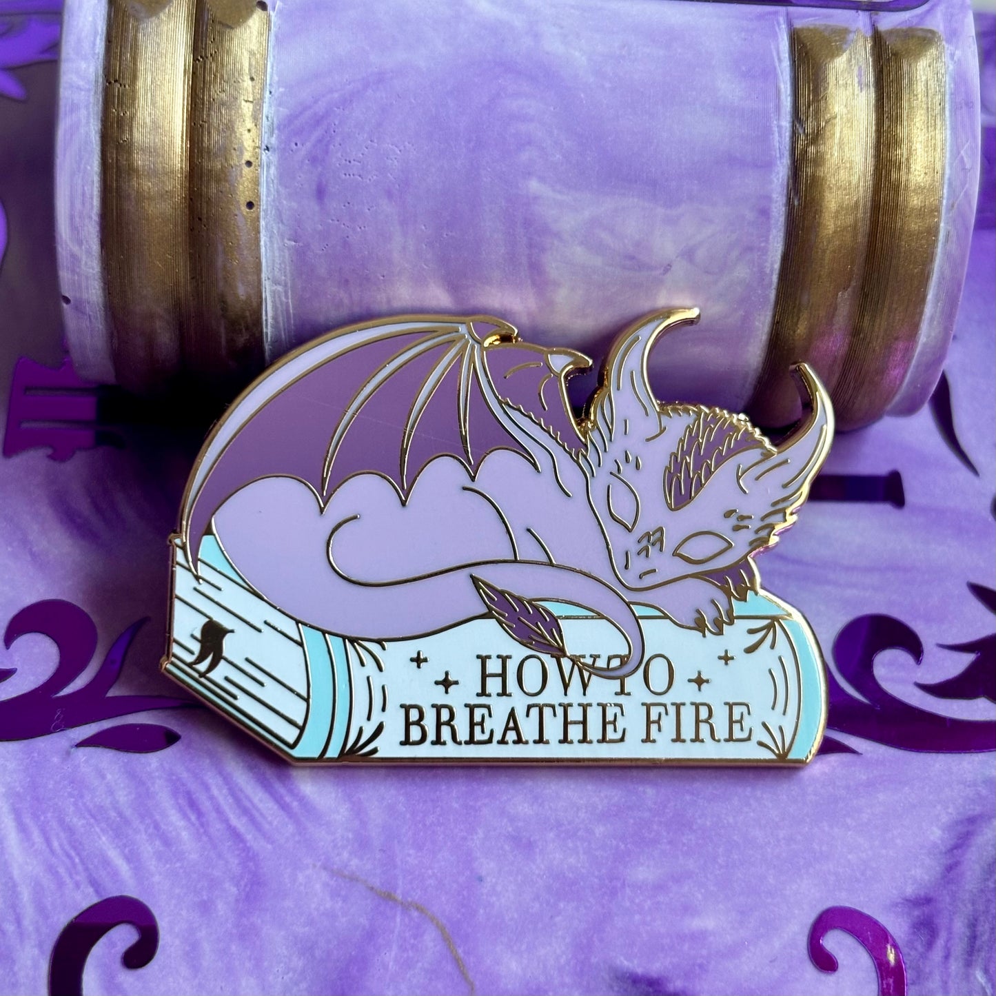 Baby Sleeping Dravon Bookstack Pin Badge. How to breathe fire.